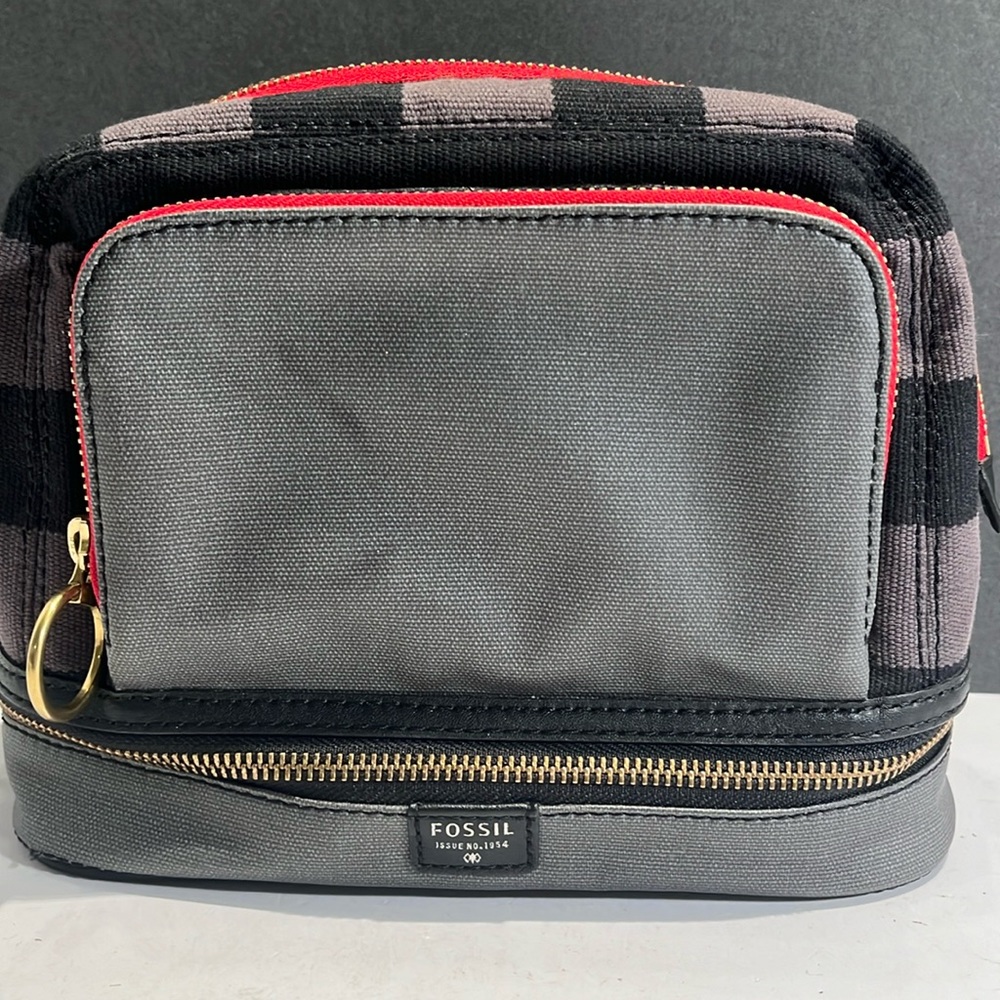Fossil cosmetic bag with red zippers, black and gray checkered print